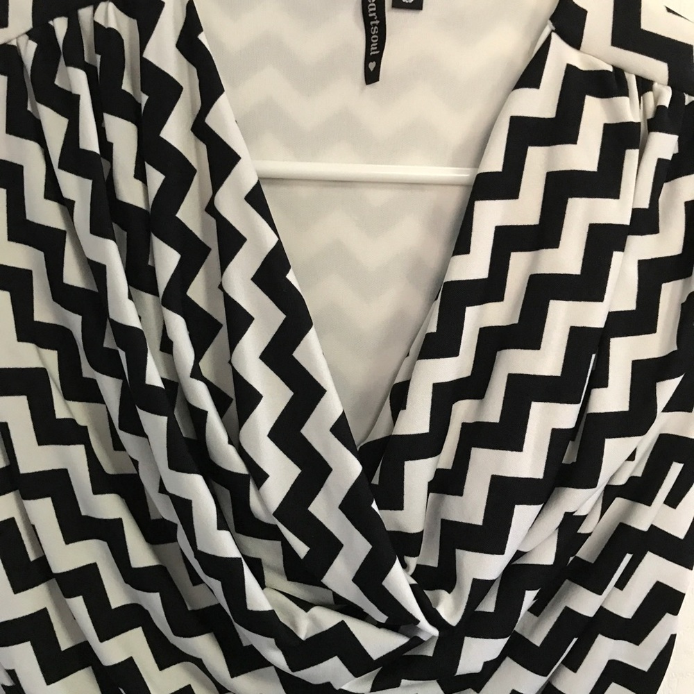 Cow neck short sleeve shirt.